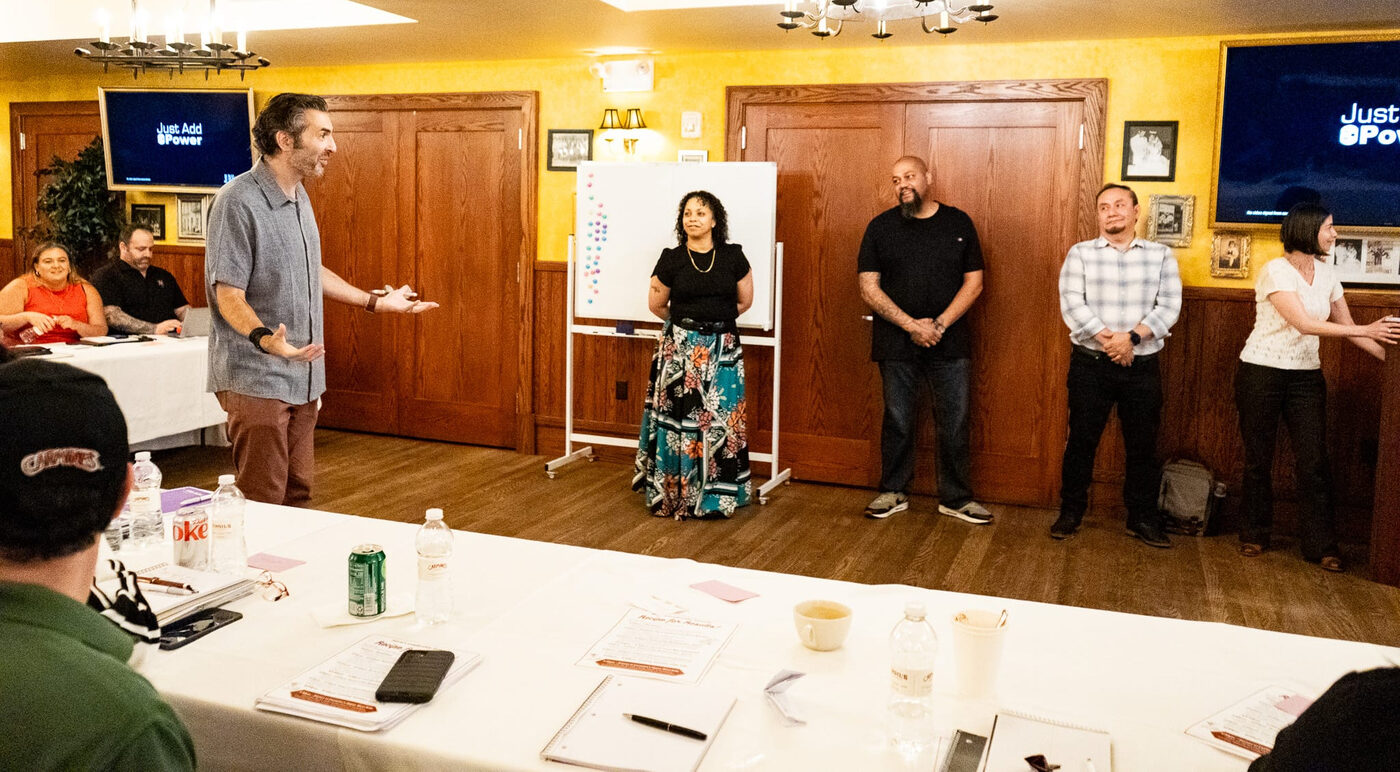 Workshop participants practicing 'Yes, And' in pairs