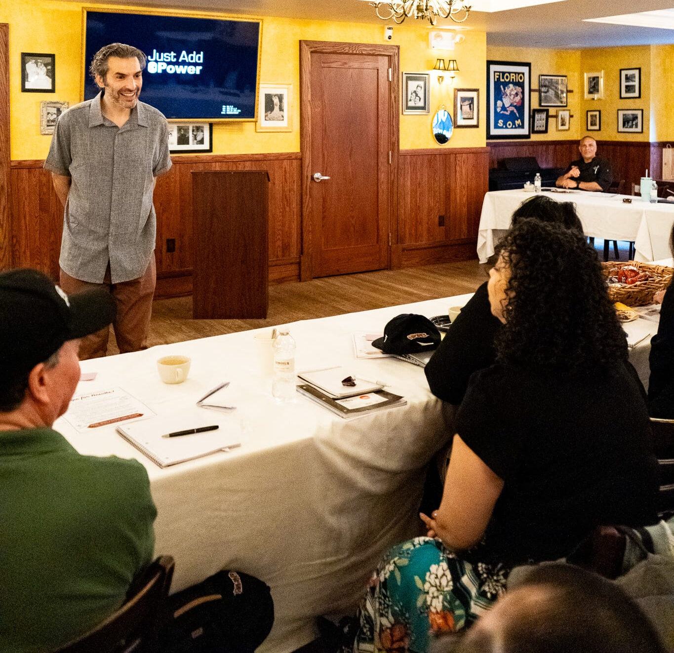 A participant speaking with confidence in front of the group